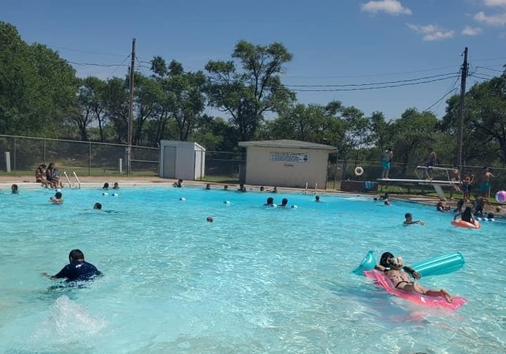 people swimming in the pool